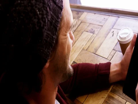 Man using digital tablet in caf̩ Stock Footage