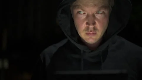 Man using digital tablet computer outdoors at night while thinking Stock Footage 317369298