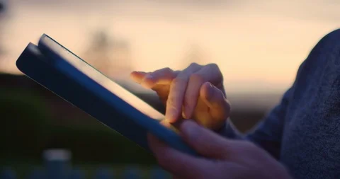 Man Using Digital Tablet During Sunset 4K Stock Footage 92367643
