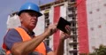Man Using Digital Tablet Engineer Work Under Development Construction Building 4k or 4k+ Resolution