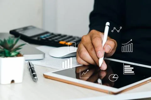 Man using digital tablet or work on table, icon graph business concept. Stock Photos