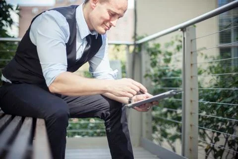 Man using digital tablet outdoors Stock Photos