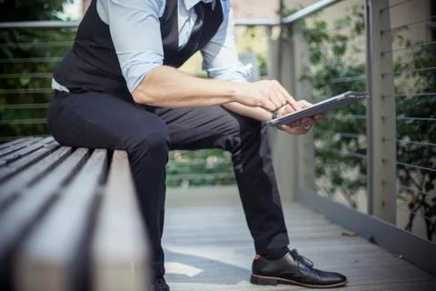 Man using digital tablet outdoors, cropped Stock Photos