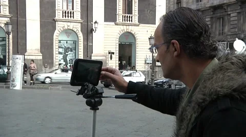 Man using digital tablet for photo shooting. Stock Footage 10725441