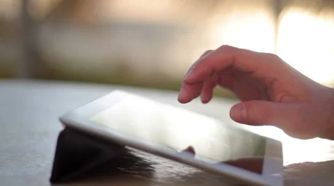 Man using digital tablet at sunrise Vidéo 50184505