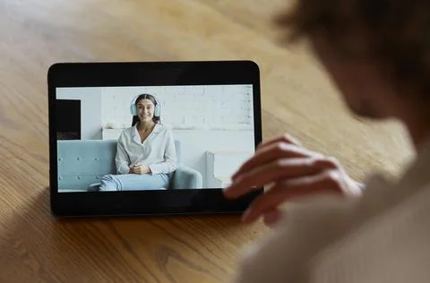 Man using digital tablet for video call with friend or coleague Stock Photos