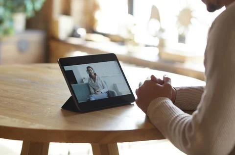 Man using digital tablet for video call with friend or coleague Stock-Fotos