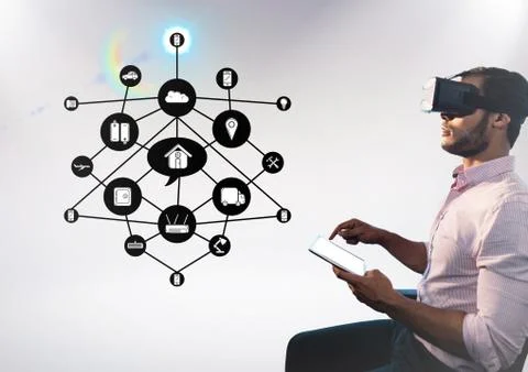 Man using digital tablet while wearing virtual reality headset with cloud Stock Photos