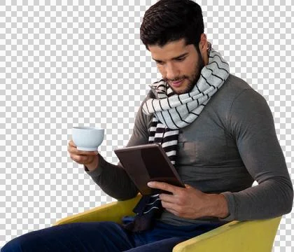 Man using digital tablet while having tea on seat Stock Photos