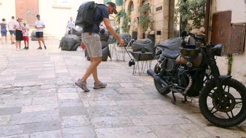 A Man Using DJI Osmo Nano Attached To Monopod Stick Recording Video Outdoors Video stock 321860845