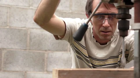 Man Using Drill Press On Wood Board 스톡 동영상 39887130