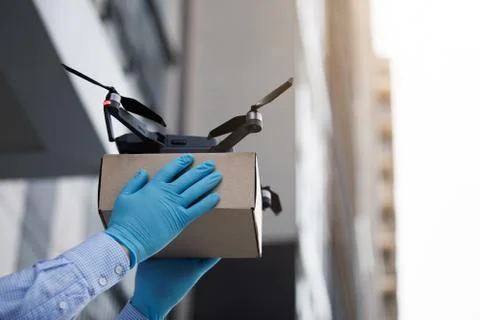 Man using drone for fast delivery of package with products Fotos de archivo