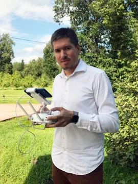 Man using drone, holding remote controller in hands Stock Photos