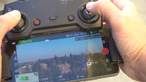 Man Using a Drone, Remote Control Live View, Close Up, Italy 2019 Stock Footage 103330664