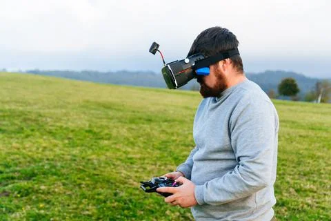 Man using a drone with remote controller wearing vr Stock Photos