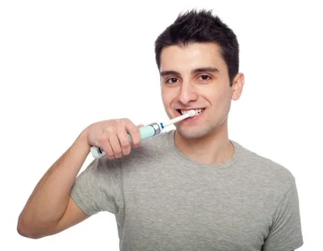 Man using electric toothbrush Stock Photos
