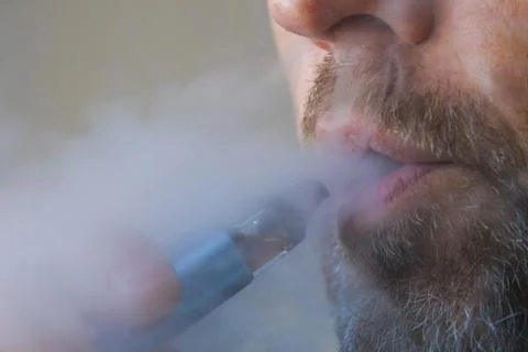 Man using electronic cigarette close up Stock Photos
