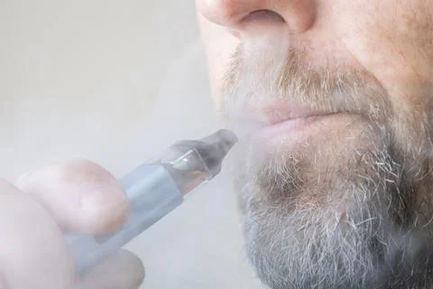 Man using electronic cigarette close up Stock Photos