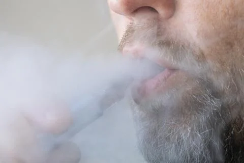Man using electronic cigarette close up Stock Photos
