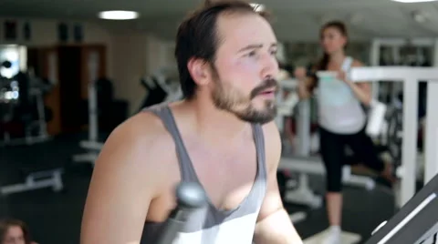 Man Using Elliptical Cross Stock Footage 42974391