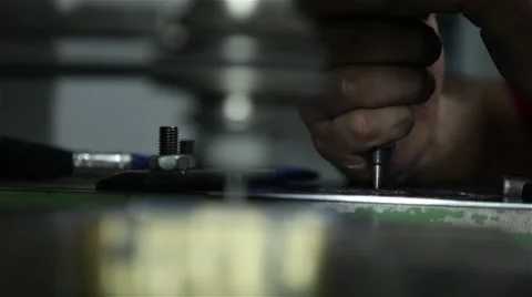 Man using engraving machine in a brass piece, focus defocus Stock Footage 58884837