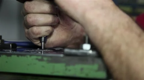 Man using engraving machine in a brass piece, slider shot Stock Footage 58885114