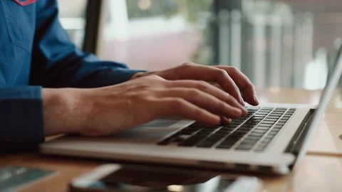 Man using finger typing on keyboard laptop computer for shopping online on ta Stock Footage 107077376