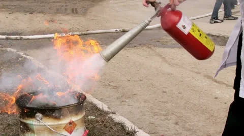 Man using fire extinguisher Stock Footage