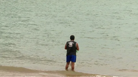 Man using fishing net on february, 2009, Florianopolis, Santa Catarina, Brasil Stock Footage 32208529
