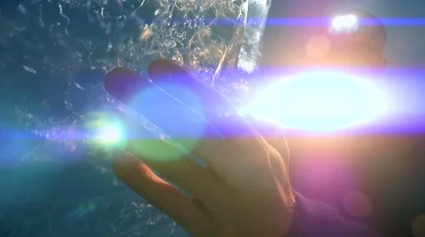 Man using flashlight to discover ice glacier cave. colorful light Stock Footage 64799743