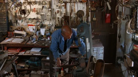Man using a Fly Press Cutting Machine in workshop. Stock Footage 72549432