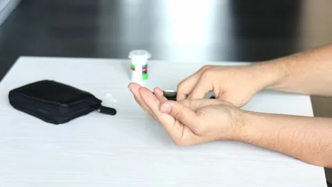 Man using glucometer, checking blood sugar level. Diabetes concept. close-up Stock Footage 164702415