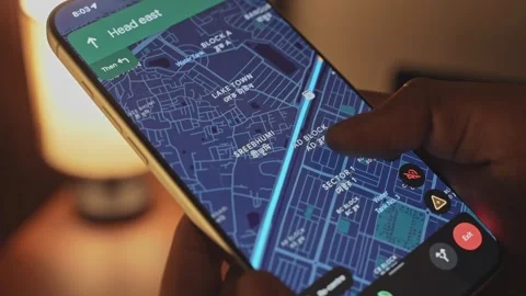 A man using google maps app on a smartphone against an ambient background Stock Footage 333292129