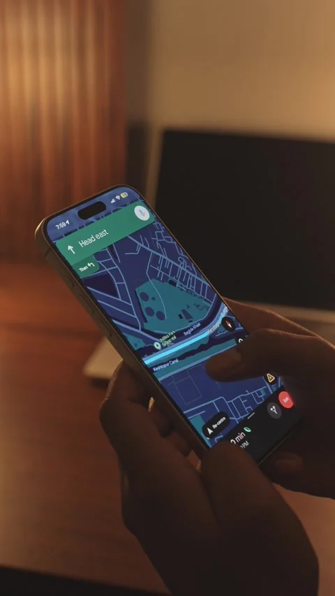 A man using google maps app on a smartphone against an ambient background Stock Footage 333292639