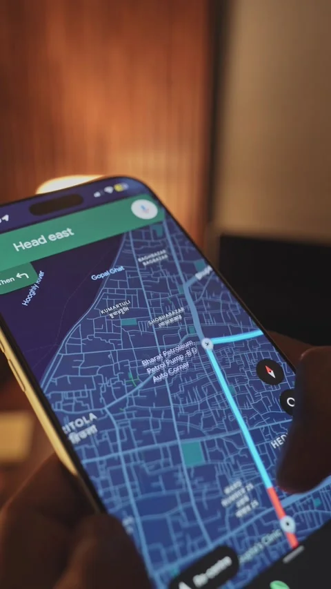 A man using google maps app on a smartphone against an ambient background Stock Footage 333293704