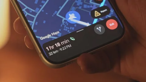 A man using google maps app on a smartphone against an ambient background Stock Footage 333295048