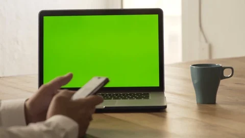 Man using a green screen laptop Stock Footage 95997310