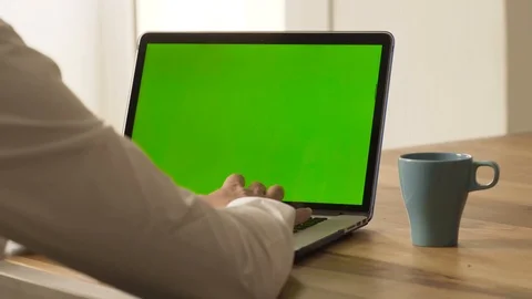 Man using a green screen laptop Stock Footage 95997311