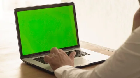 Man using a green screen laptop Stock Footage 95997315
