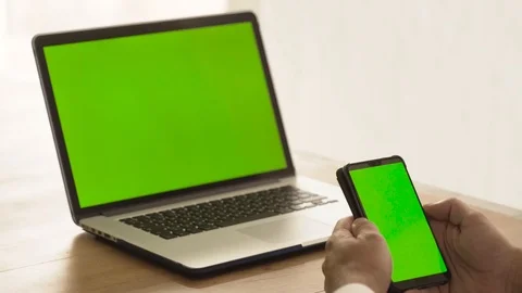 Man using a green screen laptop Stock Footage 95997322