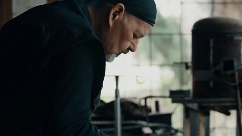 Man using hammer in the workshop Stock Footage 275449484