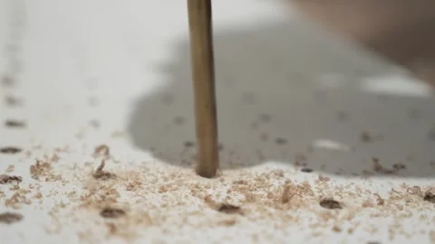 Man using hand electric drill to make holes on board plank, diy pegboard Stock Footage 290898246