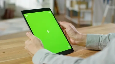 Man Using Hand Gestures on Green Mock-up Screen Digital Tablet Computer Stock Footage 94958657