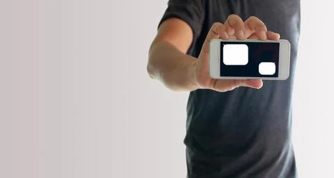 A man using hand holding the smartphone with blank message template Foto stock
