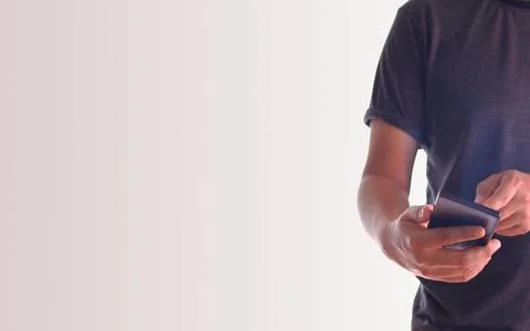A man using hand holding the smartphone Stock Photos