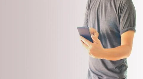 A man using hand holding the smartphone Stock Photos