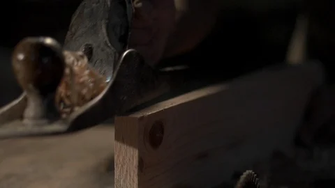 Man using a hand planer finishing his work and putting his tool down Stock Footage 98843994