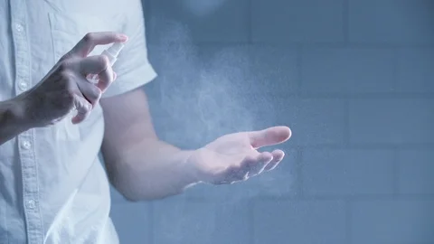 Man using hand sanitizer alcohol spray Stock Footage 126302125