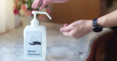 Man using hand sanitizer to clean his hands Stock Footage 128409578