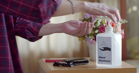 Man using hand sanitizer to clean his hands Stock Footage 128409760